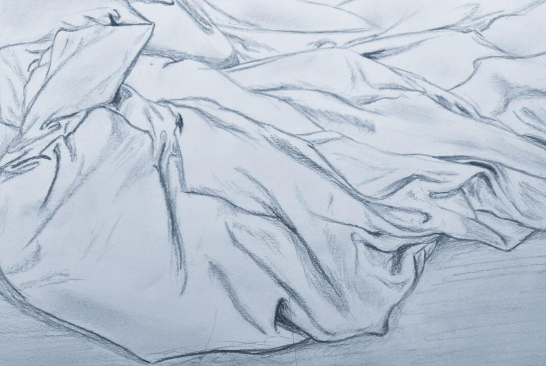 A pencil sketch of bunched up bedding fabric